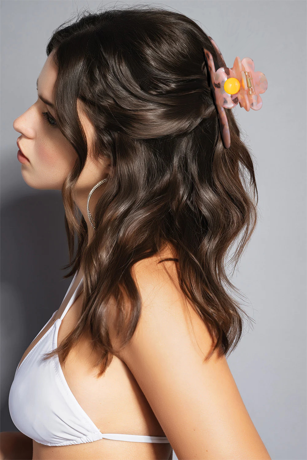 Giuno Eine Krallenklammer in Form eines langen Streifens mit Blumen